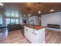 Open-concept kitchen with wood-topped island, modern appliances, and seamless flow into the living area at 1917 Piper Dr, Charleston, SC 29407