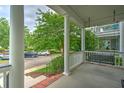 Inviting front porch featuring a relaxing porch swing, perfect for enjoying peaceful moments outdoors at 205 White Gables Dr, Summerville, SC 29483