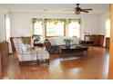 Bright and airy living room featuring large windows and light hardwood floors at 2163 Pinehurst Ave, Charleston, SC 29414