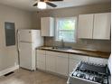 Bright kitchen featuring white cabinets, butcher block countertops, and modern appliances at 2327 Bailey Dr, North Charleston, SC 29405