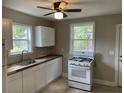 Bright kitchen featuring white cabinets, butcher block countertops, and modern appliances at 2327 Bailey Dr, North Charleston, SC 29405