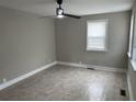 Inviting living room with neutral walls, tile floors, and a ceiling fan at 2327 Bailey Dr, North Charleston, SC 29405