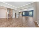 Bright living room boasting hardwood floors, recessed lighting, and an open staircase at 242 Torslanda Ln, Summerville, SC 29486