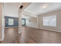 Spacious living room featuring hardwood floors, natural light, and an open-concept design at 242 Torslanda Ln, Summerville, SC 29486