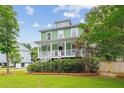 Charming two-story home with a inviting front porch in a beautiful landscaped neighborhood at 3636 Purple Martin Ct, Mount Pleasant, SC 29466