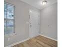 Bright entryway with wood-look floors, fresh paint, and a window for natural light at 4054 Cedars Pkwy # C, North Charleston, SC 29420