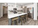 Modern kitchen featuring white cabinets, quartz countertops, and stainless steel appliances at 519 Purple Finch Rd, Summerville, SC 29486