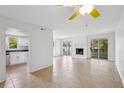 Bright living room features a fireplace, tile flooring and access to outdoor spaces via sliding glass doors at 801 Ventura Pl, Mount Pleasant, SC 29464