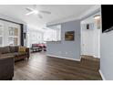 An open-concept living room with a modern ceiling fan and light blue walls at 1014 Rosewood Ln, Mount Pleasant, SC 29464