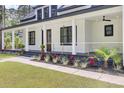 Inviting front porch with rod iron railing and manicured landscaping, perfect for relaxing outdoors at 142 Argosy Dr, Summerville, SC 29483