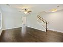 Bright living room with hardwood floors, ceiling fan and staircase to the upper level at 1506 Southwick Dr, Johns Island, SC 29455