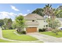 Charming two-story home with an attached garage and lush, green lawn at 16 Oatly Cir, Charleston, SC 29414