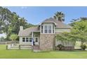 Charming home with brick accents, manicured lawn and inviting front porch at 16 Oatly Cir, Charleston, SC 29414