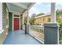 Inviting front porch with colorful flooring and a classic railing, perfect for relaxing outdoors at 173 Fishburne St, Charleston, SC 29403