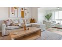 Inviting living room features a sectional sofa, neutral color scheme, and modern art at 1815 Long Bend Dr, Seabrook Island, SC 29455