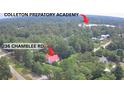 Aerial shot of the home with a red roof and the Colleton Preparatory Academy in the distance at 236 Chamblee Rd, Walterboro, SC 29488