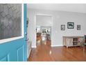 Inviting entryway with hardwood floors leading into a living space and a bright blue front door at 281 Decatur Dr, Summerville, SC 29486