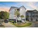 Two-story home with light gray siding, a balcony, landscaped yard, and convenient driveway parking at 2928 Tranquility Rd, Mount Pleasant, SC 29466
