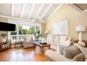 Bright living room with hardwood floors, high ceilings, comfortable seating, and large windows at 30 Beachside Dr, Isle of Palms, SC 29451