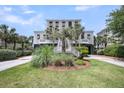 Charming two-story beach house with lush landscaping, driveway, and plenty of curb appeal at 3126-B Palmetto Blvd # 4, Edisto Island, SC 29438