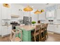 Bright, open kitchen with a large center island and modern stainless steel appliances at 383 Oak Park St, Summerville, SC 29486