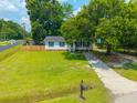 Inviting single-story home with a lush lawn and mature shade trees in a quiet neighborhood at 401 Amy Dr, Goose Creek, SC 29445