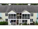 Aerial view of townhouse with screened-in porches, colorful siding, and an inviting entryway at 403 Sunny Side Way, Summerville, SC 29485