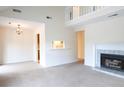 Bright and airy living room featuring a fireplace, neutral carpet, and stairway to the second floor at 403 Sunny Side Way, Summerville, SC 29485