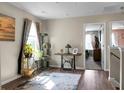 Cozy, sunlit room featuring hardwood floors, decorative accents, and view into the next room at 508 Glady Rd, Moncks Corner, SC 29461
