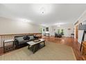 Open living area with wood floors, a comfortable seating area, and dining space at 6840 Early Jersey Rd, Meggett, SC 29449
