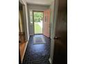 Entryway features black tile flooring, view of the front yard, and a pink front door at 101 Brittany Ct, Summerville, SC 29485