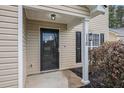 Close-up of front door with house number, black hardware, and tasteful landscaping at 110 Yorkshire Dr, Summerville, SC 29483