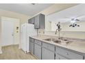 Spacious kitchen featuring gray cabinets and stainless steel sink at 1104 Greenmeadow Dr, Goose Creek, SC 29445