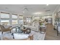Bright and airy living room with neutral tones, hardwood floors, and lots of natural light at 111 Augusta Pass Dr, Ridgeville, SC 29472