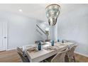 Bright dining room with hardwood floors and decorative chandelier above the table at 112 Orchard Blossom Ln, Summerville, SC 29485