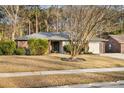 Single-story brick home with an attached garage and a well-manicured lawn at 113 Surrey Dr, Summerville, SC 29486