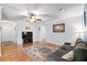 Inviting living room with hardwood floors, a ceiling fan, and a comfortable gray sofa at 113 Surrey Dr, Summerville, SC 29486
