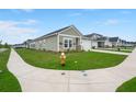 Street view of a well-maintained single Gathering home with green lawn and concrete sidewalk at 1150 Cooper Point St, Summerville, SC 29485