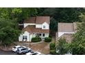 Overhead shot of the home with a brown roof, surrounded by lush green trees and a driveway with parked cars at 1211 Meadow Park Ln # B, Mount Pleasant, SC 29464