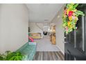 Inviting entryway featuring a colorful floral wreath and views into the living spaces at 123 Lyra Ln, Summerville, SC 29486
