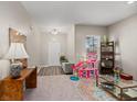 Bright living room showcasing neutral tones and ample natural light from a nearby window at 123 Lyra Ln, Summerville, SC 29486