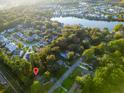 Aesthetic aerial view of homes nestled by a lake and surrounded by lush greenery at 1351 Winifred St, Mount Pleasant, SC 29464