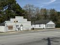 Street view of the property showcasing the charming house and the neighborhood at 1488 Remount Rd, North Charleston, SC 29406