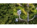 An aerial view of the house nestled among mature trees, showcasing its location and surrounding landscape at 162 Whippoorwill Dr, Summerville, SC 29483