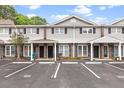 Townhome exterior with assigned parking spots in front of well-maintained facade at 1713 Boone Hall Dr # 1082, Charleston, SC 29407