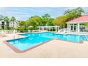 Community pool with lounge chairs, shaded seating, and a meticulously maintained pool house at 2011 N Highway 17 # 1400A, Mount Pleasant, SC 29466