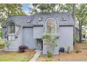 Grey two-story home with distinctive architectural details like arched windows and dormers at 2159 Spoleto Ln # E, North Charleston, SC 29406