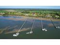Waterfront home with a private dock and boat lift, offering direct access to the marshlands at 2621 Anchor Watch Dr, Wadmalaw Island, SC 29487