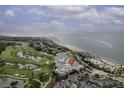 Stunning aerial view of coastal resort featuring golf course, beach, and ocean views at 2942 Atrium Villa Dr # 42, Johns Island, SC 29455