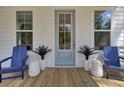 Charming front porch with rocking chairs, stylish planters, and ample natural light at 3035 Robeson Trce, Johns Island, SC 29455